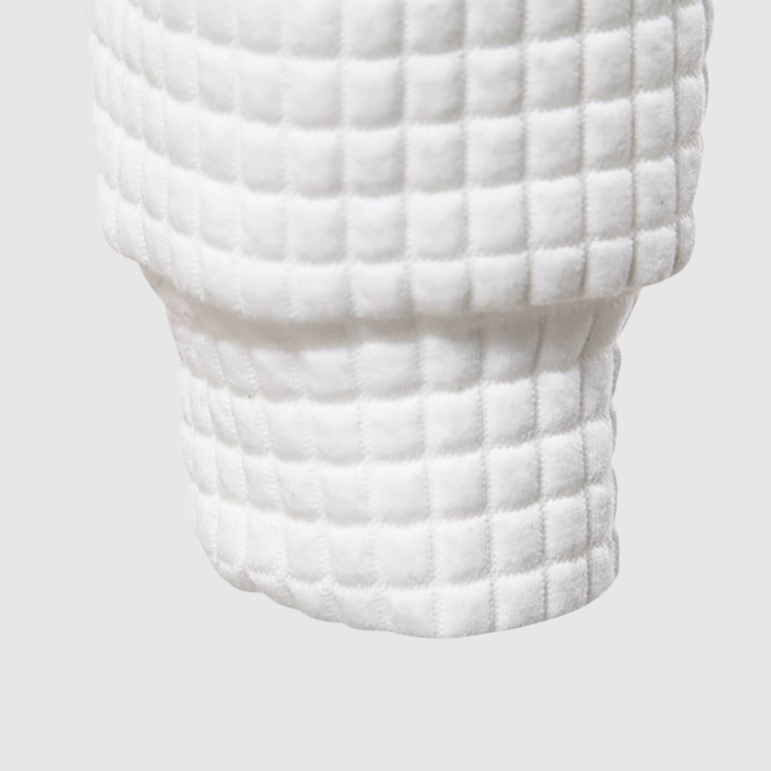 Klaus – Kapuce ar quiltētu struktūru un auklu