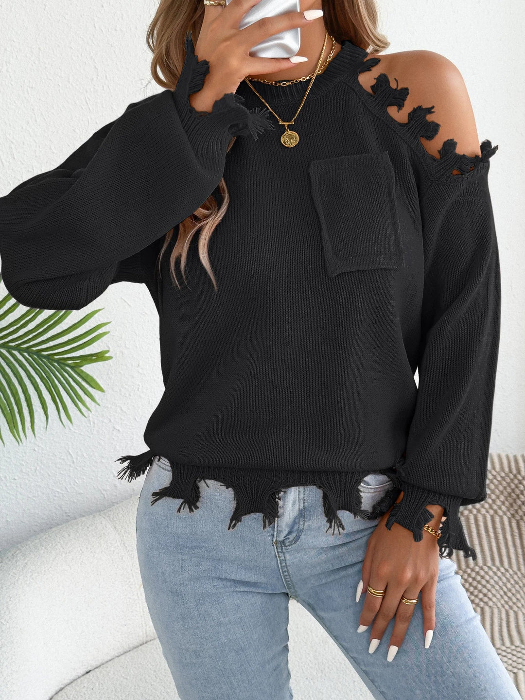 Plecu bez piedurknēm ar pušķiem džemperis